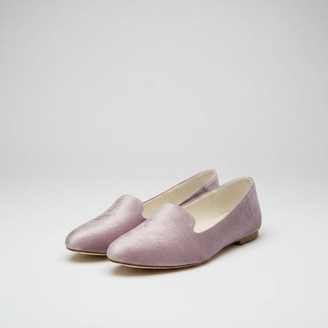 A pair of women's slip-on loafers in a dusty mauve velvet fabric, shown from a top-down view on a wooden surface. The brand name 'CHIAFFERO' is visible on the insoles.
