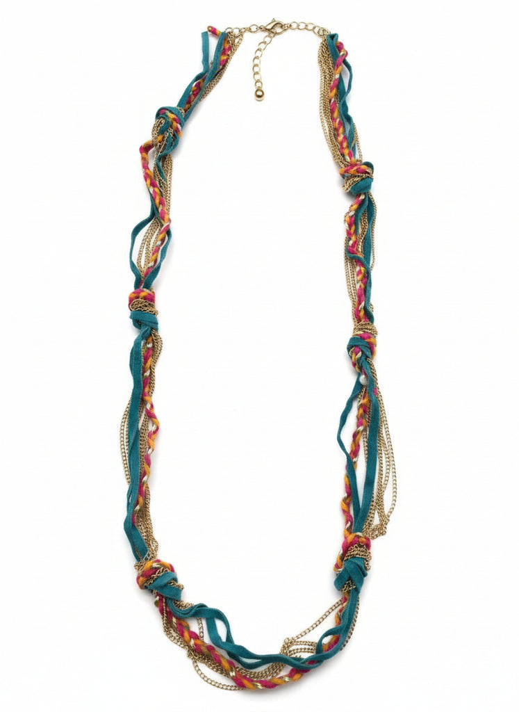 Colorful braided headband on a wooden surface